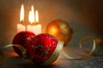 The burning candles, balls and gold ribbons it are Christmas